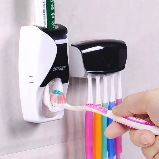 Tooth Brush Holder And Paste Dispenser
